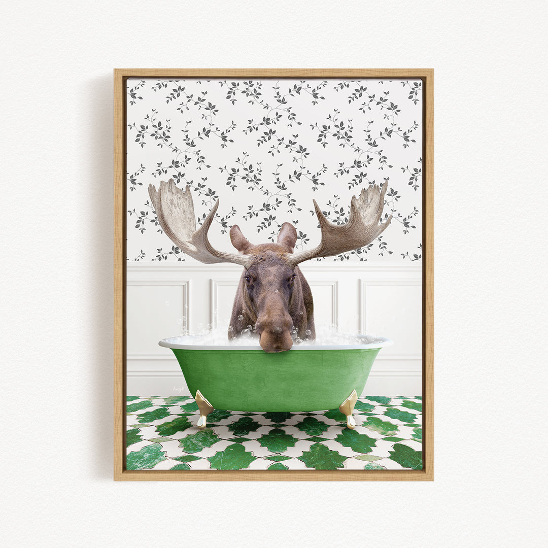 A moose with large antlers is sitting in a green bathtub filled with water, surrounded by a patterned green and white floor.