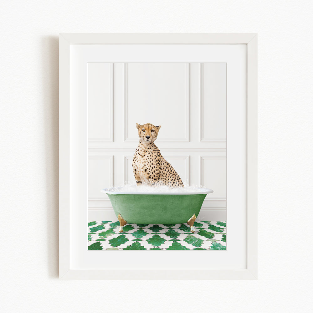 A cheetah sitting in a green bathtub filled with water, surrounded by a green and white patterned rug.