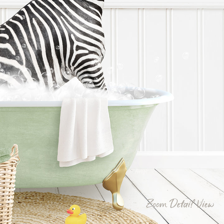A zebra standing in a green bathtub filled with bubbles, with a towel and a rubber duck nearby.