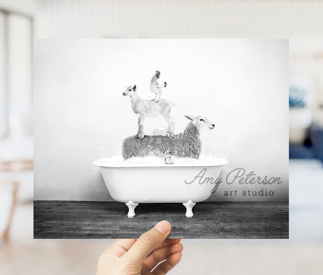 a person holding up a picture of a goat in a bathtub