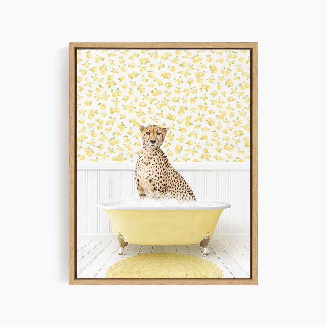 A cheetah sitting in a yellow bathtub filled with water, with a yellow floral wallpaper in the background.