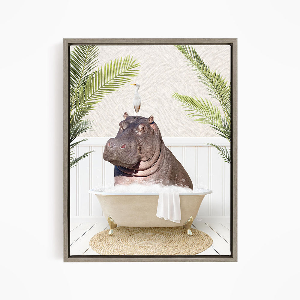 A framed image depicting a hippopotamus sitting in a bathtub, with a bird perched on its head.