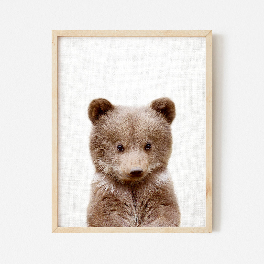 a picture of a brown bear in a wooden frame