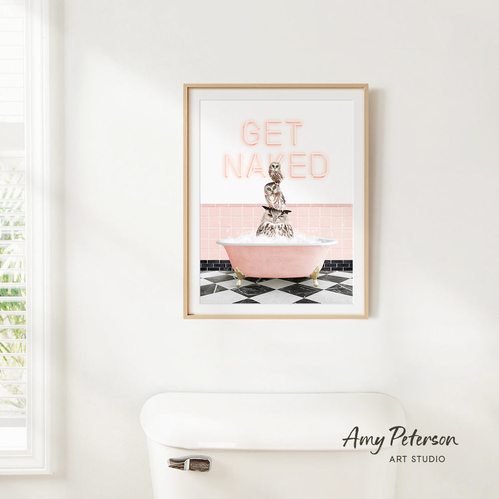 a framed print of a pink bathtub with a person sitting inside it, and the text "GET NAKED" is displayed above the bathtub.