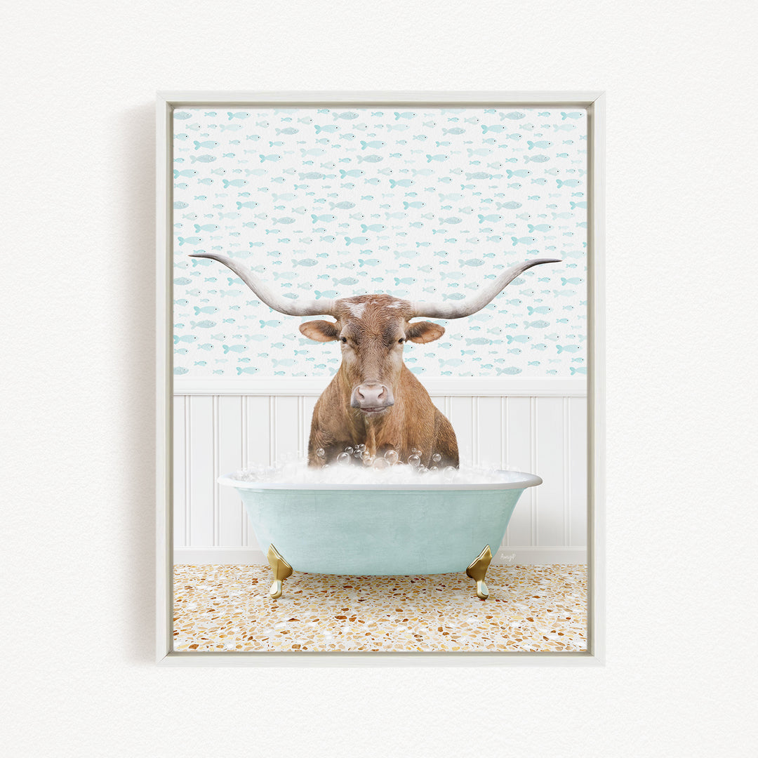 A brown steer with large horns is sitting in a light blue bathtub filled with bubbles, against a background of fish.