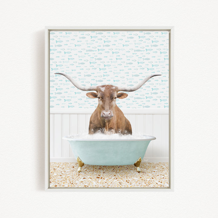 A brown steer with large horns is sitting in a light blue bathtub filled with bubbles, against a background of fish.