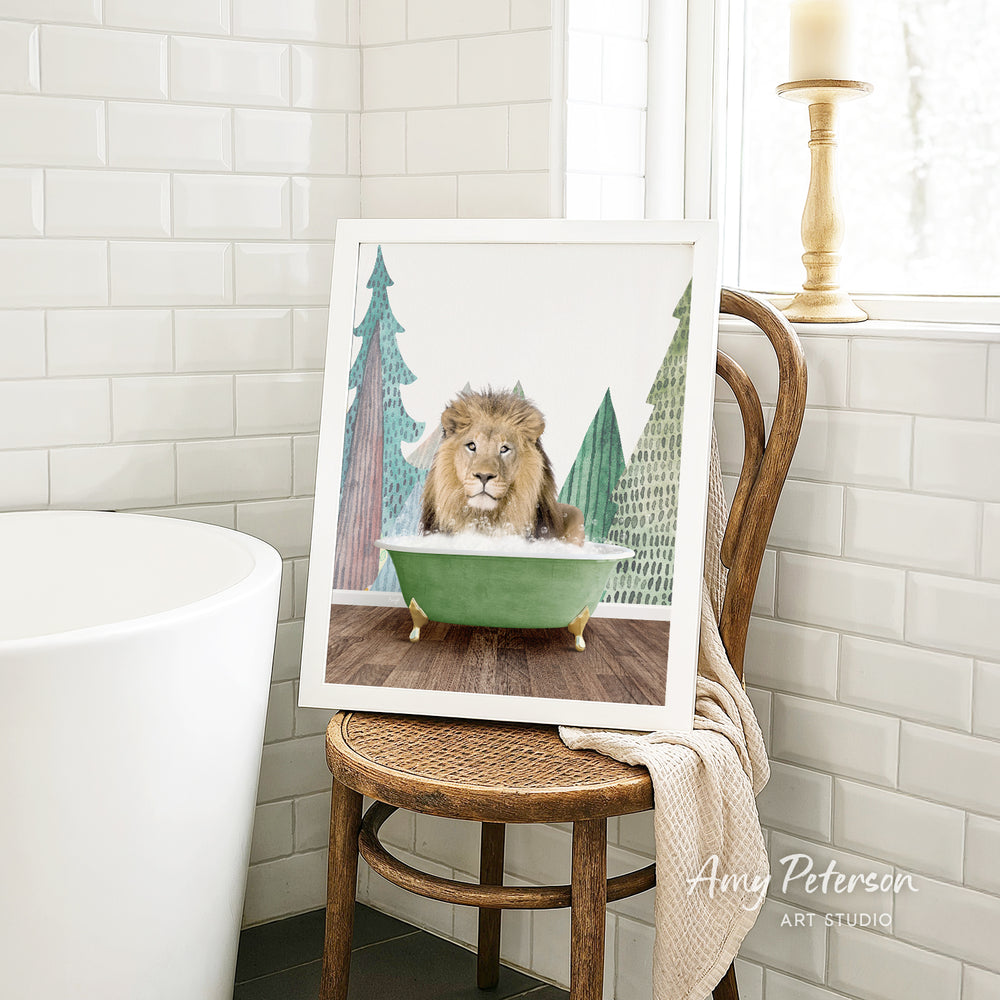 A framed image of a lion sitting in a green bathtub, surrounded by trees, is displayed on a wooden chair in a bathroom setting.