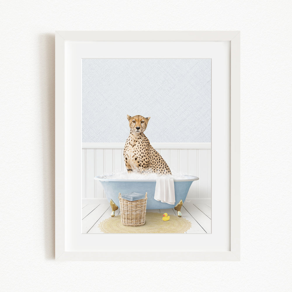 A cheetah sitting in a blue bathtub filled with water, surrounded by rubber ducks.