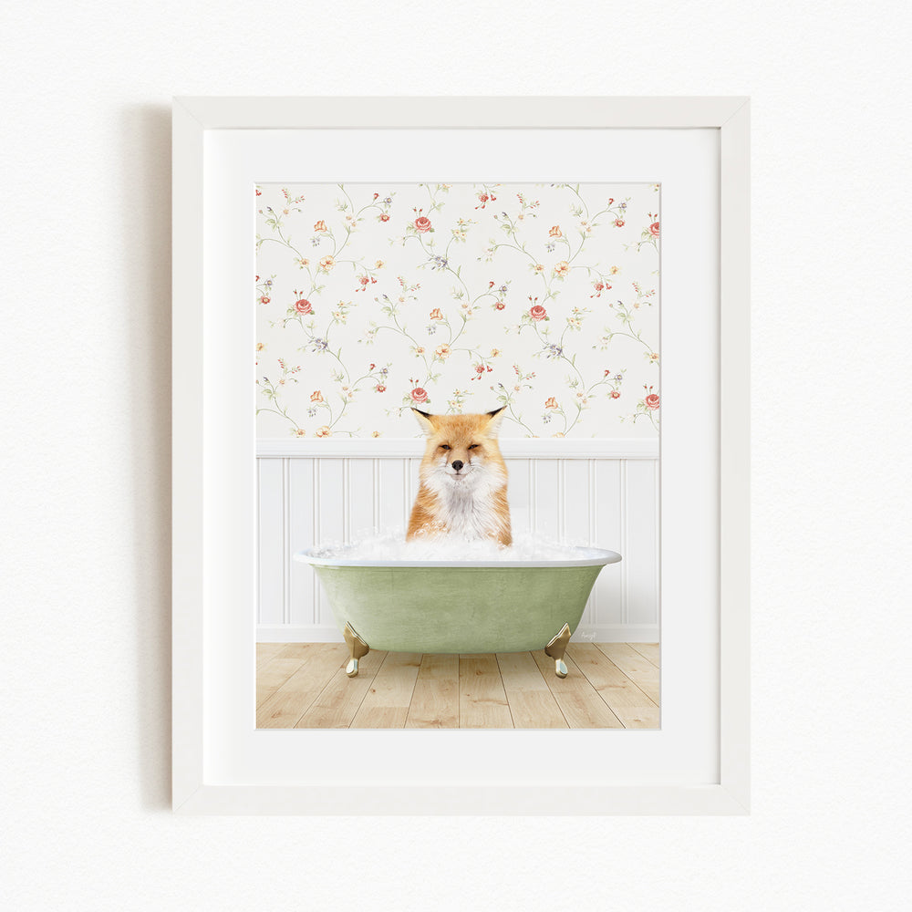 A fox is sitting in a green bathtub filled with bubbles, with a floral wallpaper in the background.
