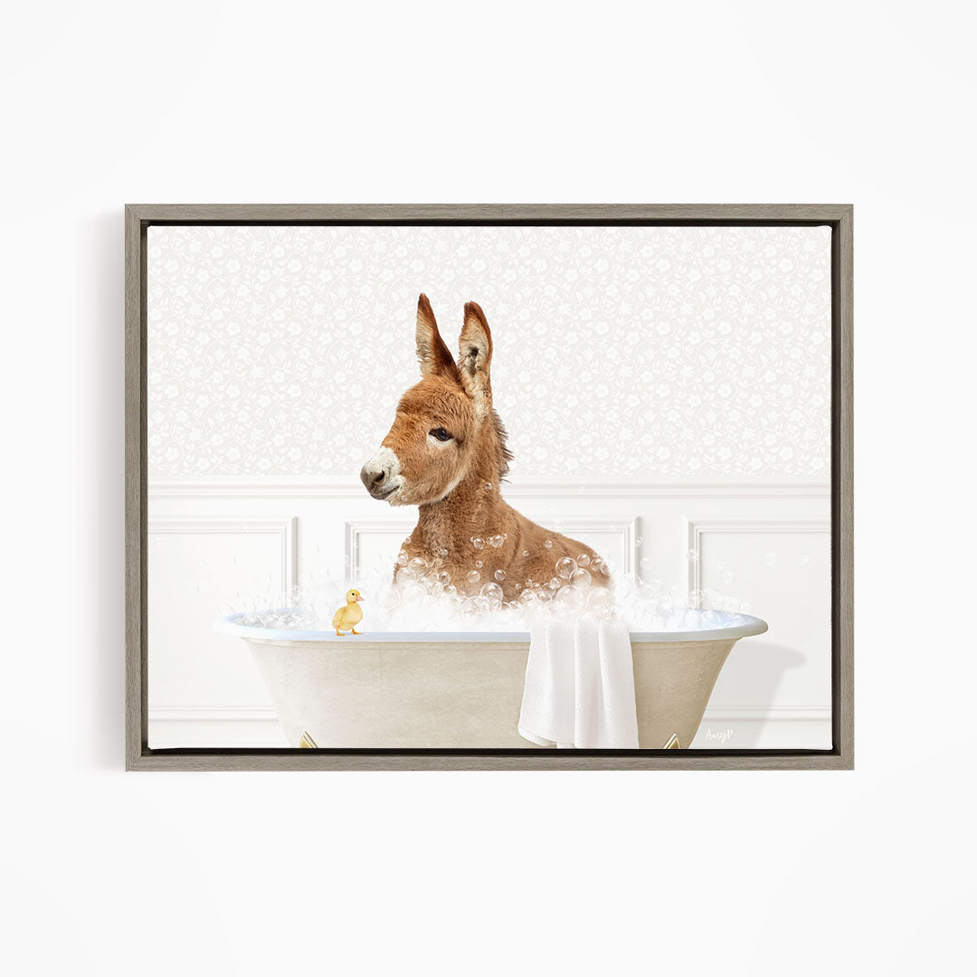 A donkey is sitting in a bathtub filled with water, surrounded by bubbles, with a small yellow duck nearby.