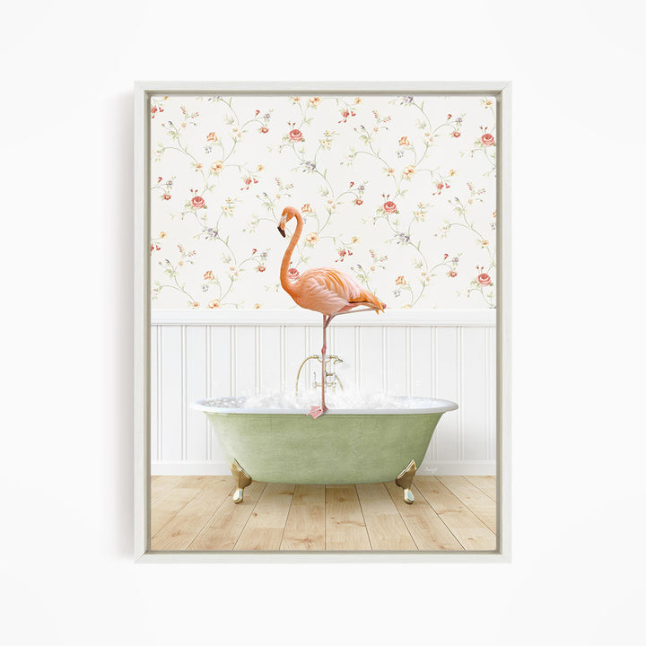 A pink flamingo stands on the edge of a green bathtub, with a floral wallpaper in the background.