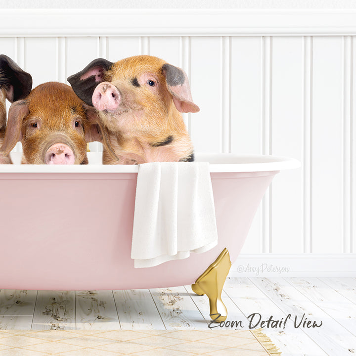 Two adorable pigs sitting in a pink bathtub, with a towel and gold object nearby.
