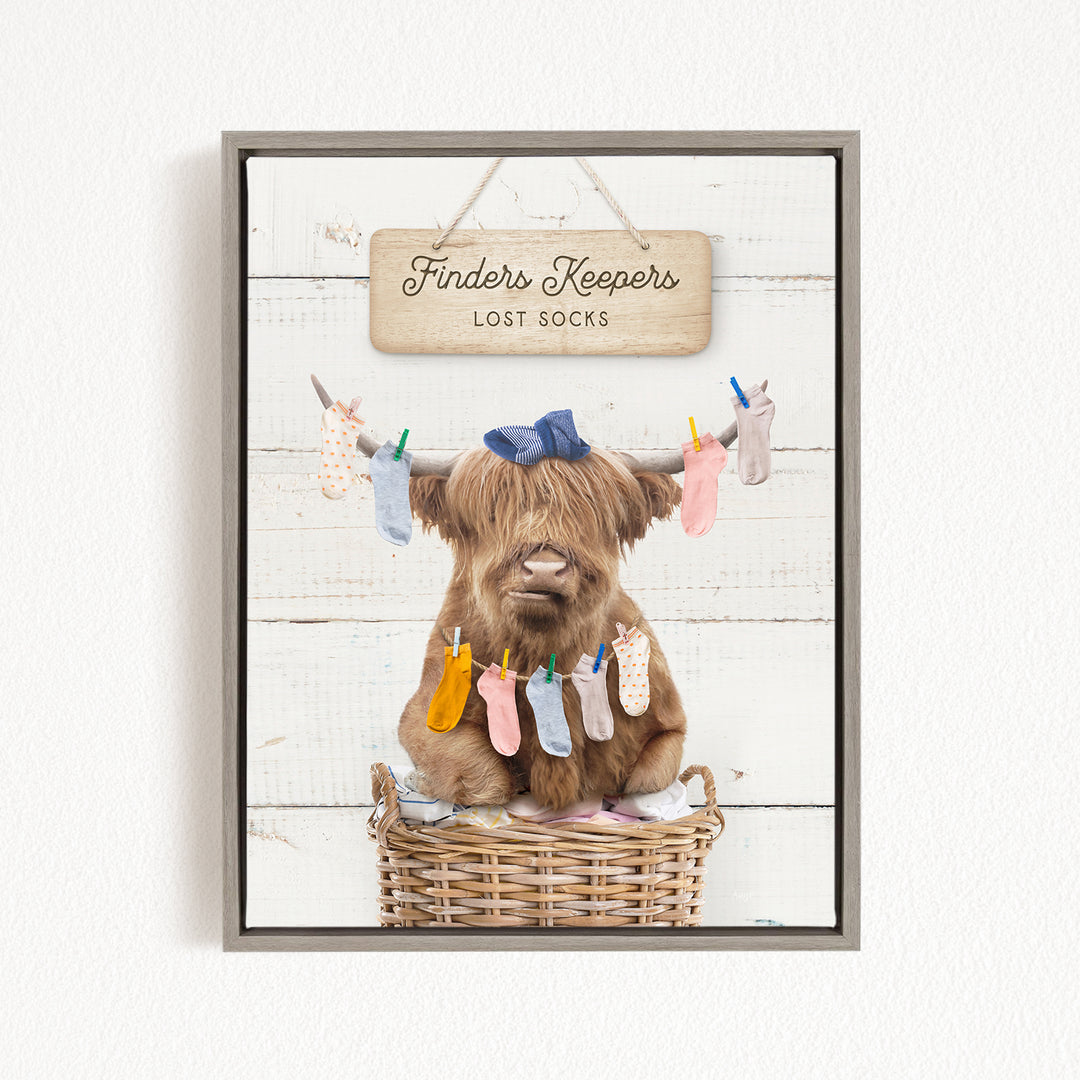 A brown cow sitting in a wicker basket, surrounded by colorful socks hanging from clotheslines.