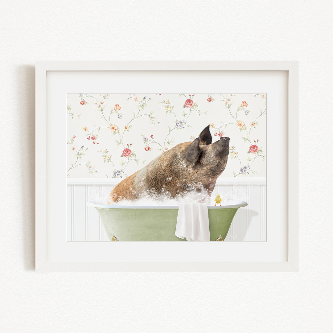 A brown pig sitting in a green bathtub filled with bubbles, with a floral wallpaper in the background.