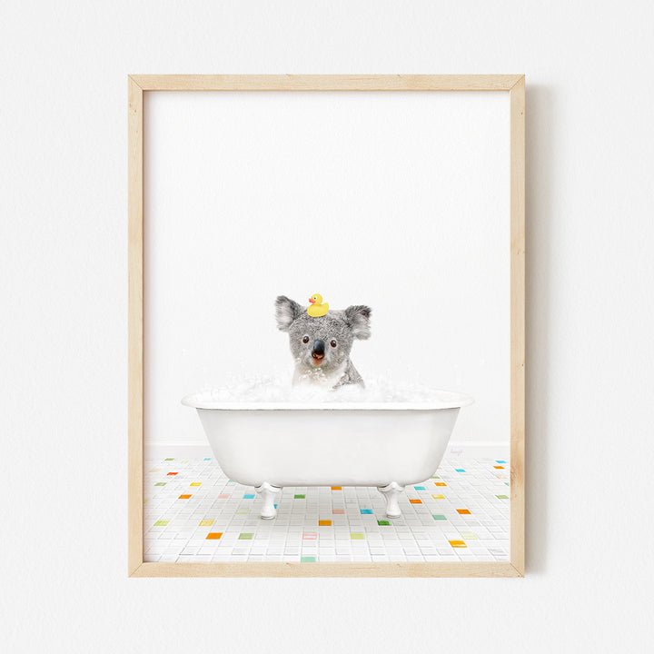 a framed photo of a koala in a bathtub