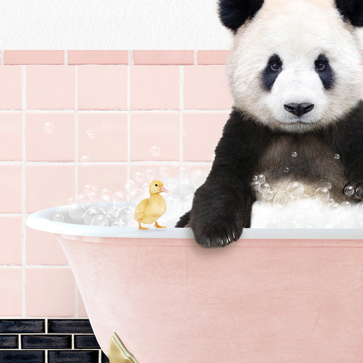 a panda bear in a bathtub with bubbles and a rubber duck