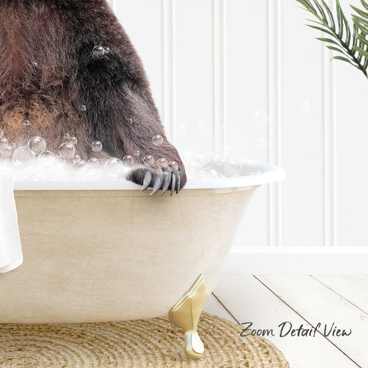 A close-up of a bear's paw in a bathtub filled with bubbles, with a plant visible in the background.