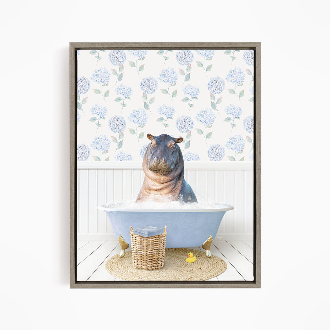 A hippopotamus sitting in a bathtub filled with water, surrounded by a wicker basket and yellow rubber ducks.