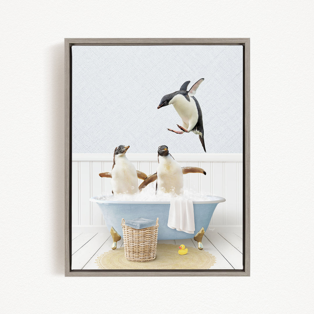 A framed image depicting two penguins sitting in a bathtub, with one penguin flying towards the other penguin.