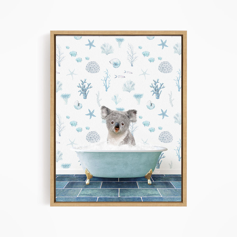 A koala bear sitting in a blue bathtub filled with water, surrounded by a pattern of blue and white marine life.