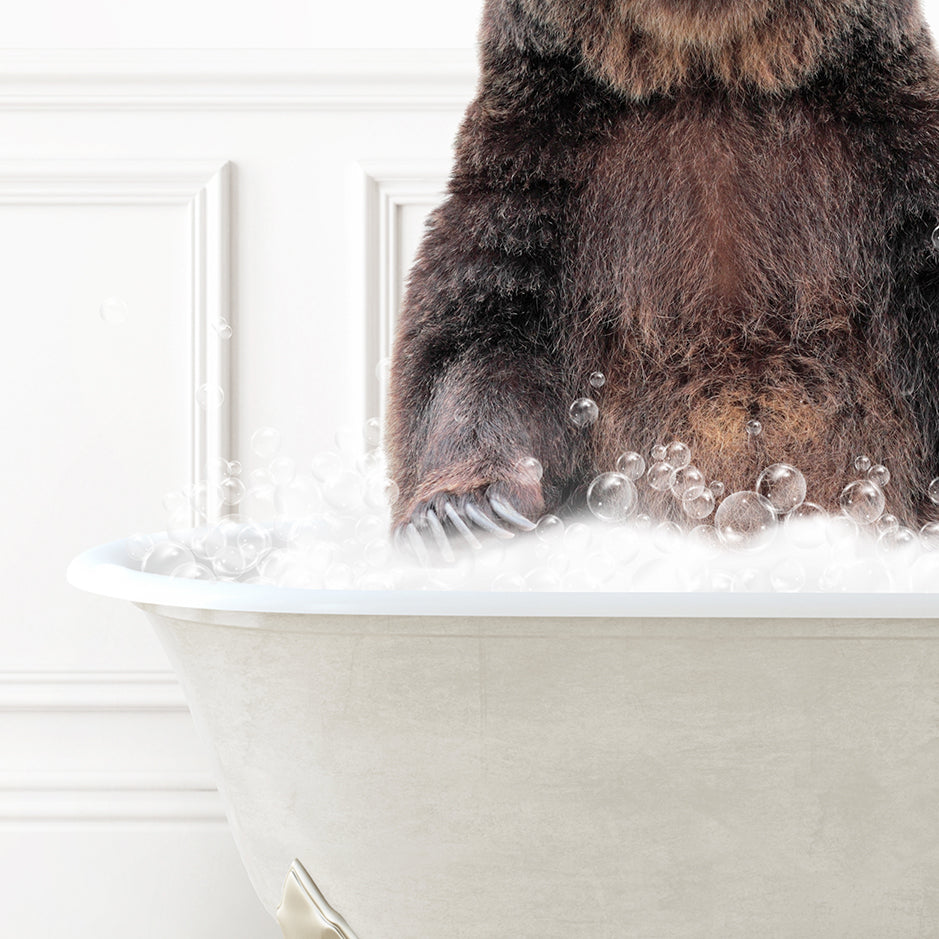 a brown bear sitting in a bathtub filled with bubbles