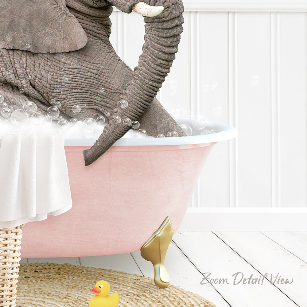 A large gray elephant is sitting in a pink bathtub filled with bubbles, surrounded by a yellow rubber duck and a white towel.