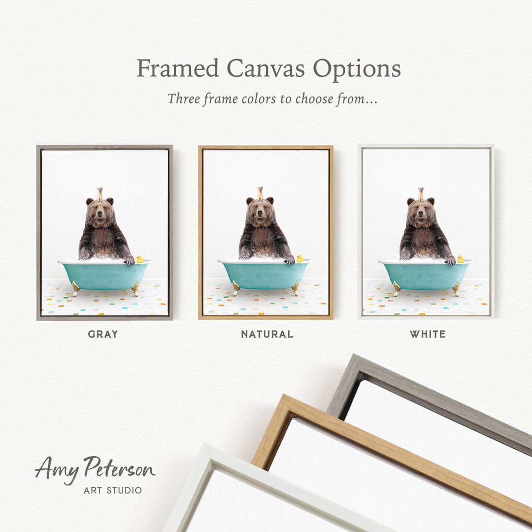 three framed canvas options featuring a bear sitting in a bathtub, each with a different frame color: gray, natural, and white.