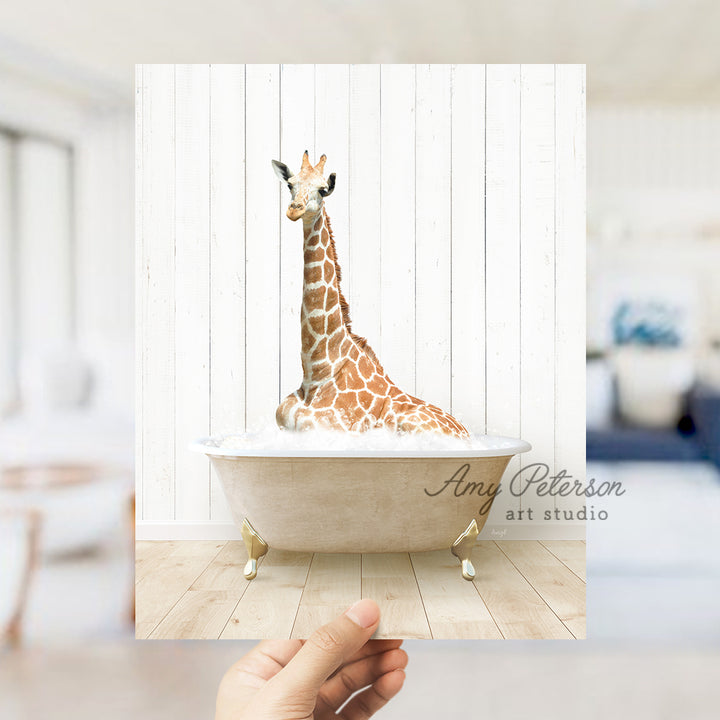 a giraffe is sitting in a bath tub