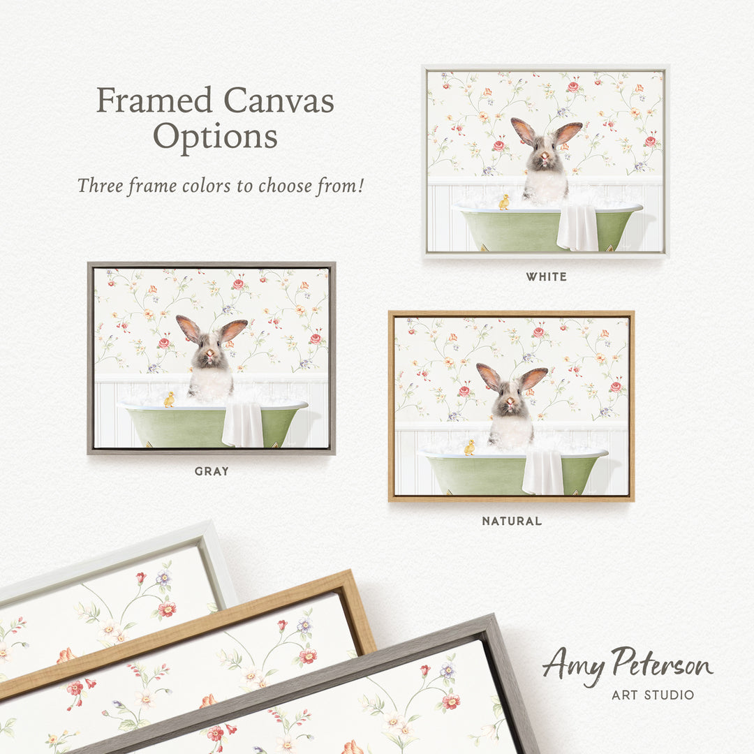 The image is a framed canvas with three different options for frame colors: white, gray, and natural. The canvas features a small rabbit sitting in a green bathtub, surrounded by a floral pattern.
