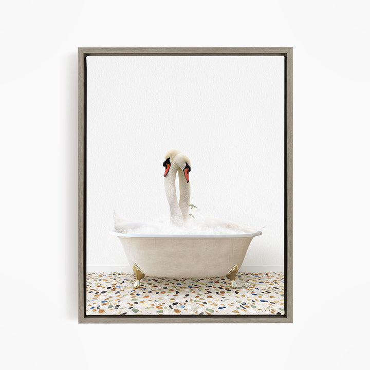 A pair of swans standing in a white bathtub filled with water, with a speckled floor beneath them.