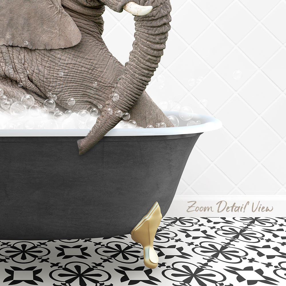 A large gray elephant is sitting in a bathtub filled with bubbles, with a gold-colored bathtub leg visible.