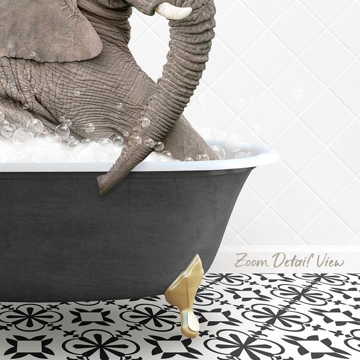 A large gray elephant is sitting in a bathtub filled with bubbles, with a gold-colored bathtub leg visible.