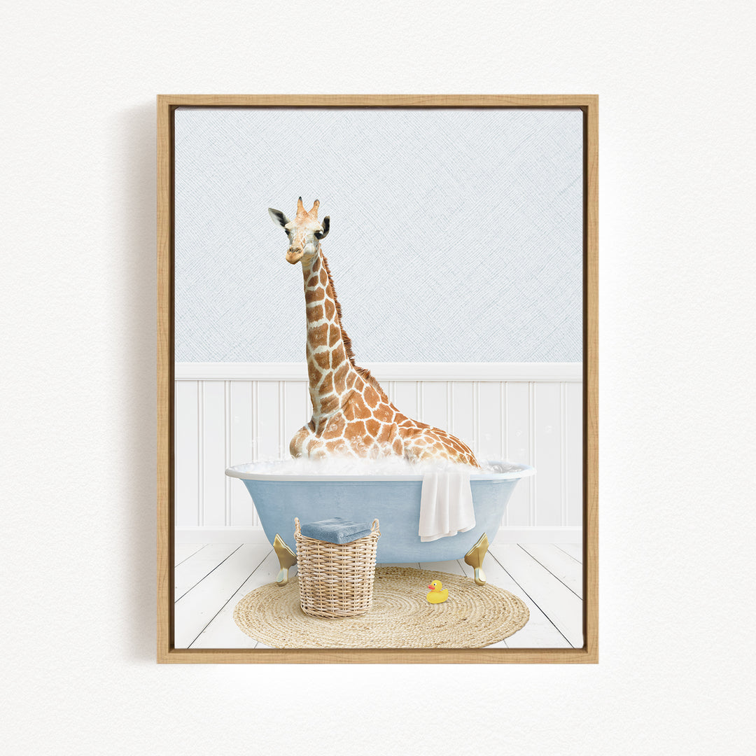A giraffe sitting in a blue bathtub filled with water, surrounded by a basket and a yellow rubber duck.
