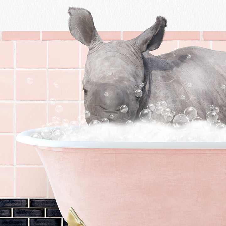 a rhino is taking a bath in a pink bathtub