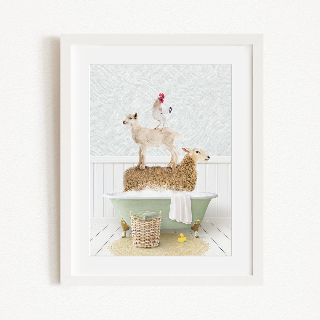 A framed image depicting a goat standing on top of a sheep in a bathtub, with a rooster perched on the sheep's back.