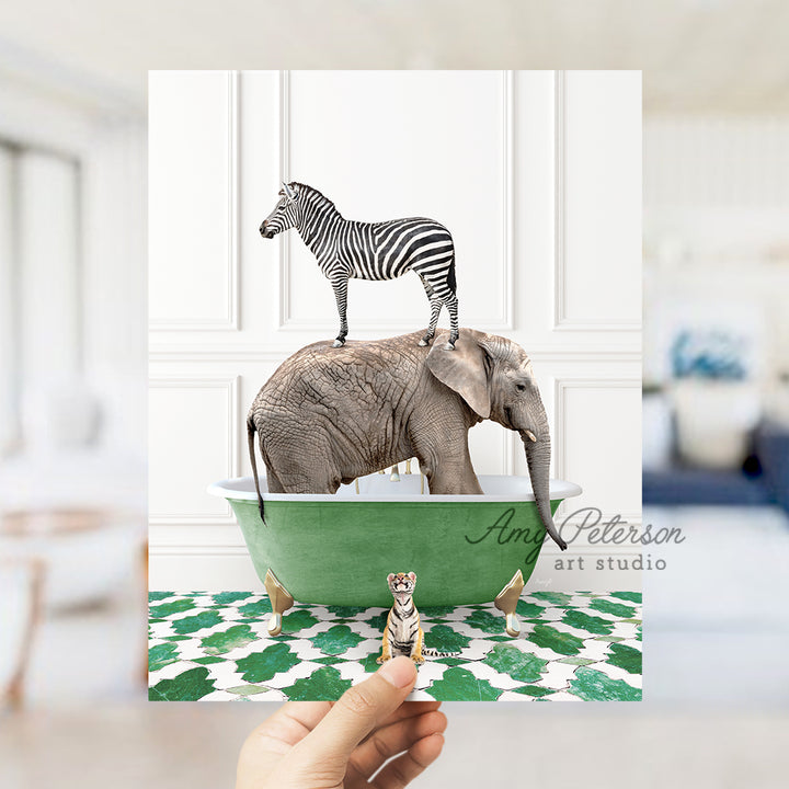 a hand holding a card with a zebra and an elephant on top of an elephant