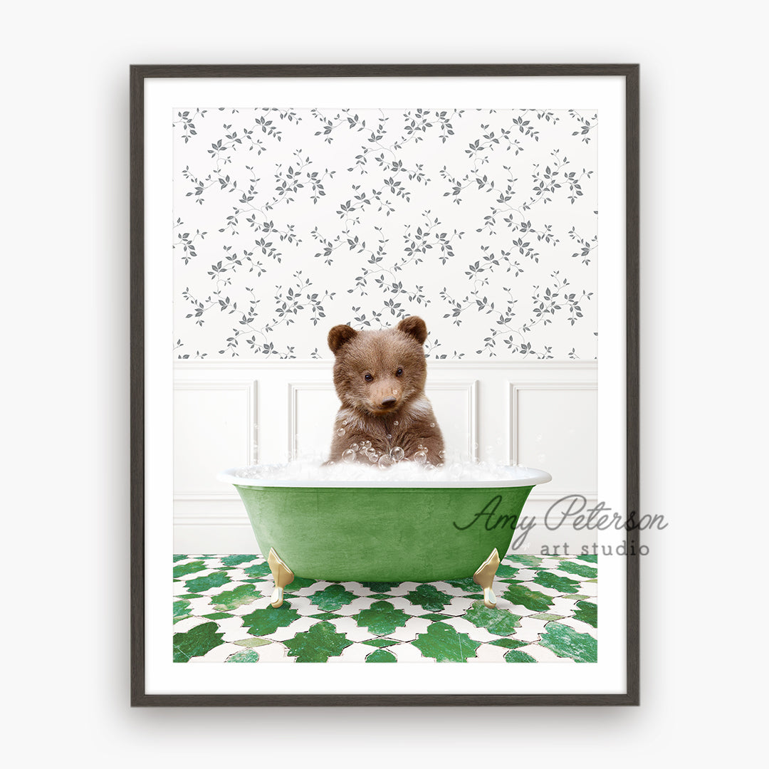 a brown teddy bear sitting in a green bath tub