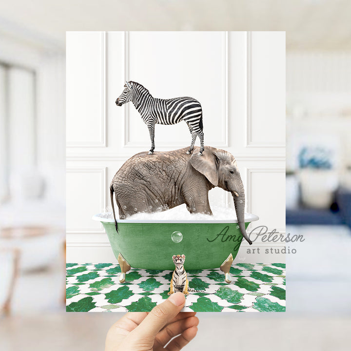 a person holding up a card with a picture of a zebra and an elephant on