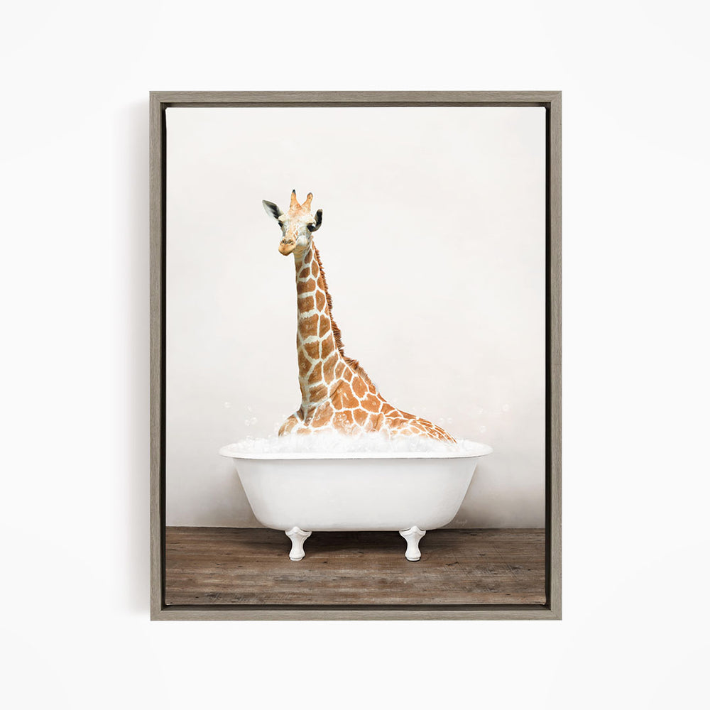 A giraffe sitting in a white bathtub filled with bubbles, creating a whimsical and playful scene.