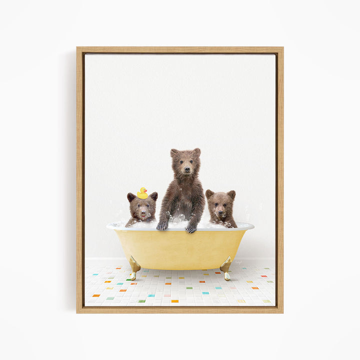 A framed image depicting three bears sitting in a yellow bathtub, with one bear sitting in the center and two bears sitting on either side.