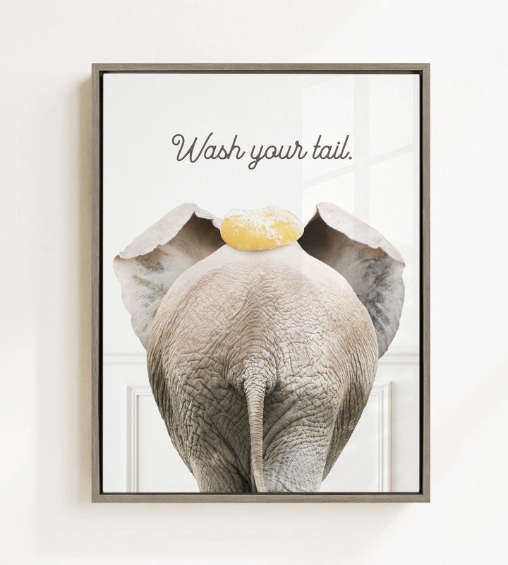 an elephant with a yellow object on its head, accompanied by the text "Wash your tail."
