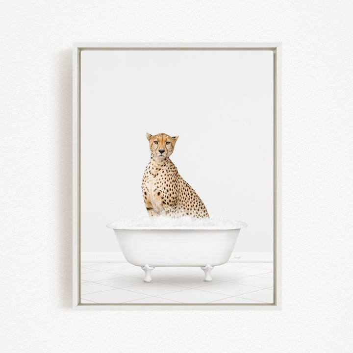 A cheetah sitting in a white bathtub filled with water.