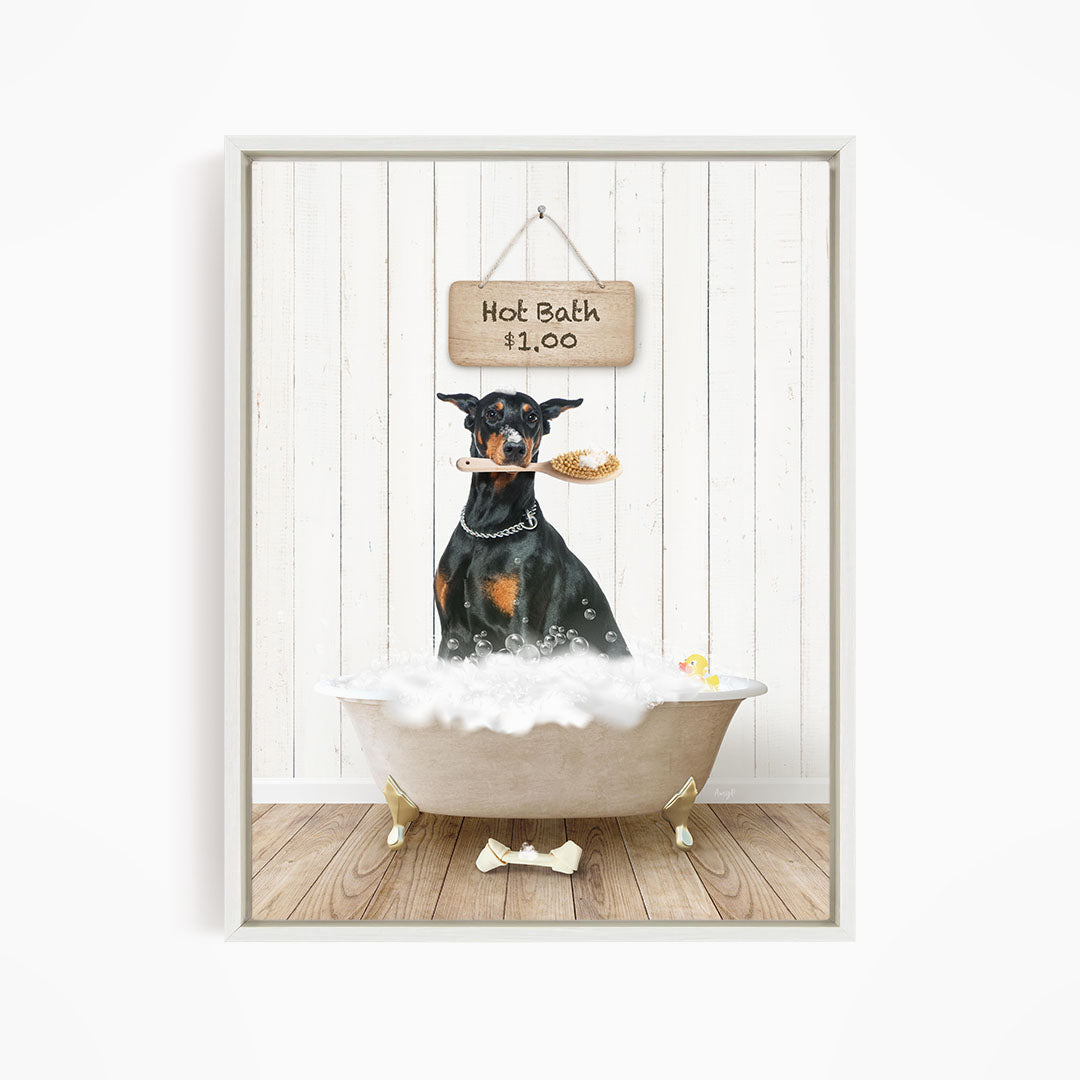 A black and brown dog is sitting in a white bathtub filled with bubbles, with a sign above the tub that reads "Hot Bath $1.00".