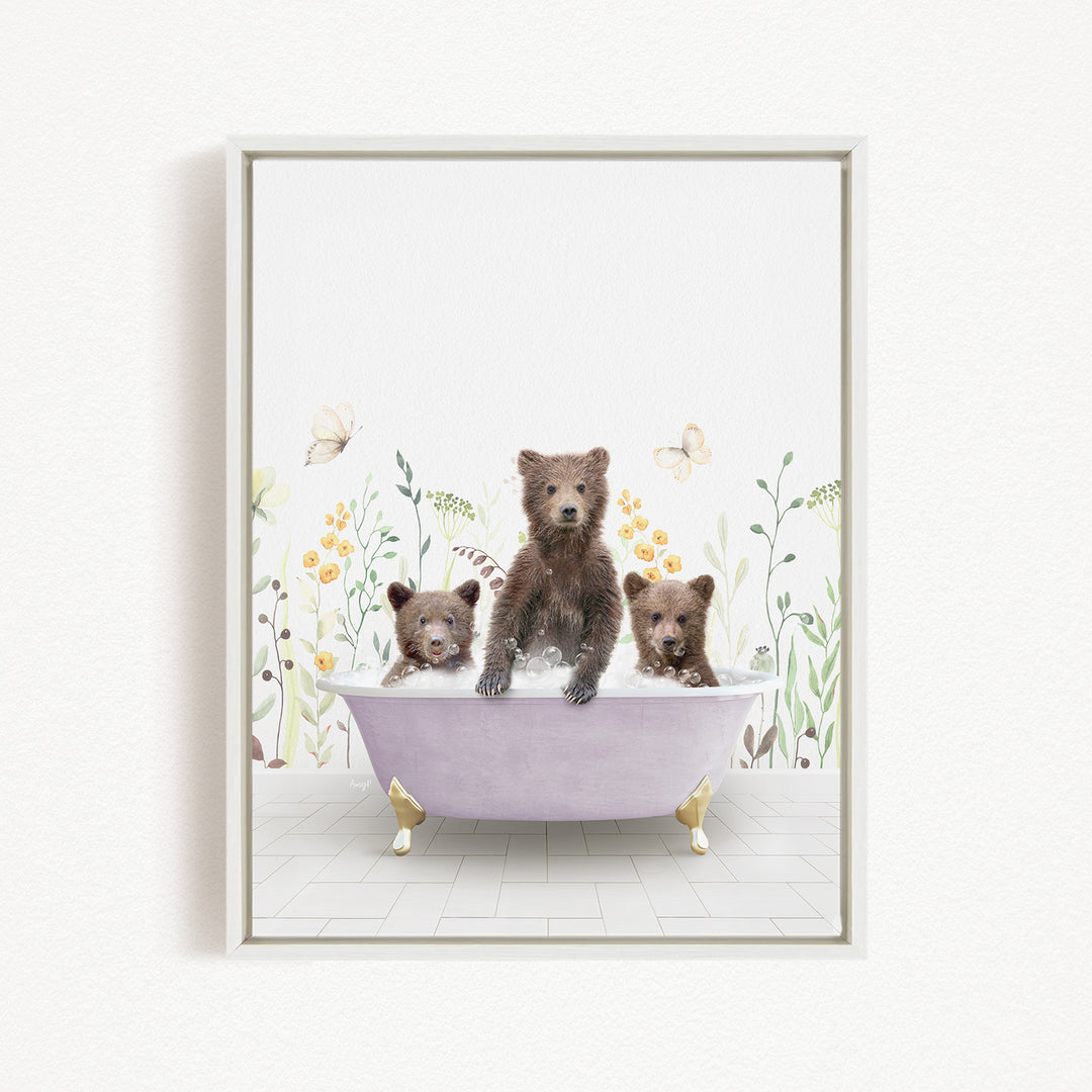 A framed illustration depicting three bears sitting in a bathtub filled with water, surrounded by flowers and butterflies.