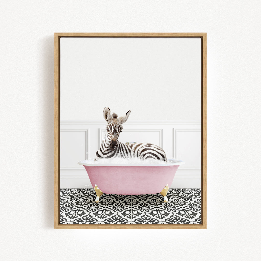A zebra is sitting in a pink bathtub, surrounded by a black and white patterned floor.