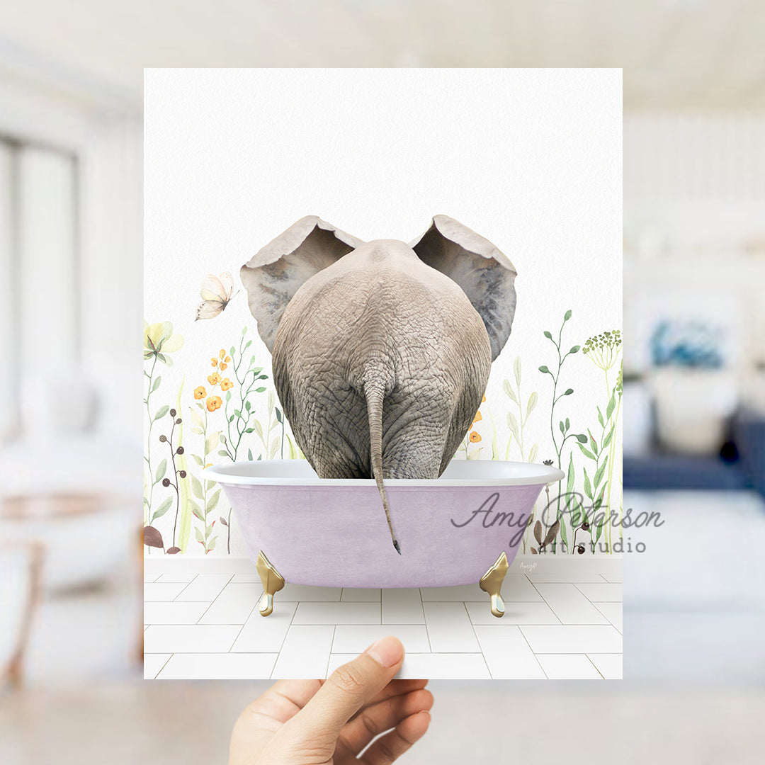 a person holding up a card with an elephant in a bathtub