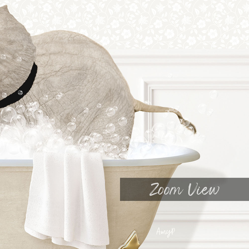 A white elephant is sitting in a bathtub filled with bubbles, with a towel hanging on the side.