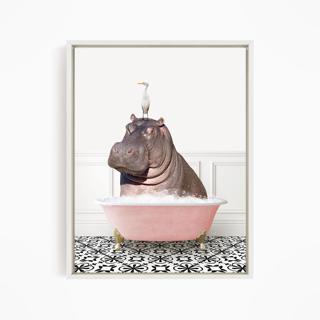 A large hippopotamus is sitting in a pink bathtub, with a white bird perched on its head.
