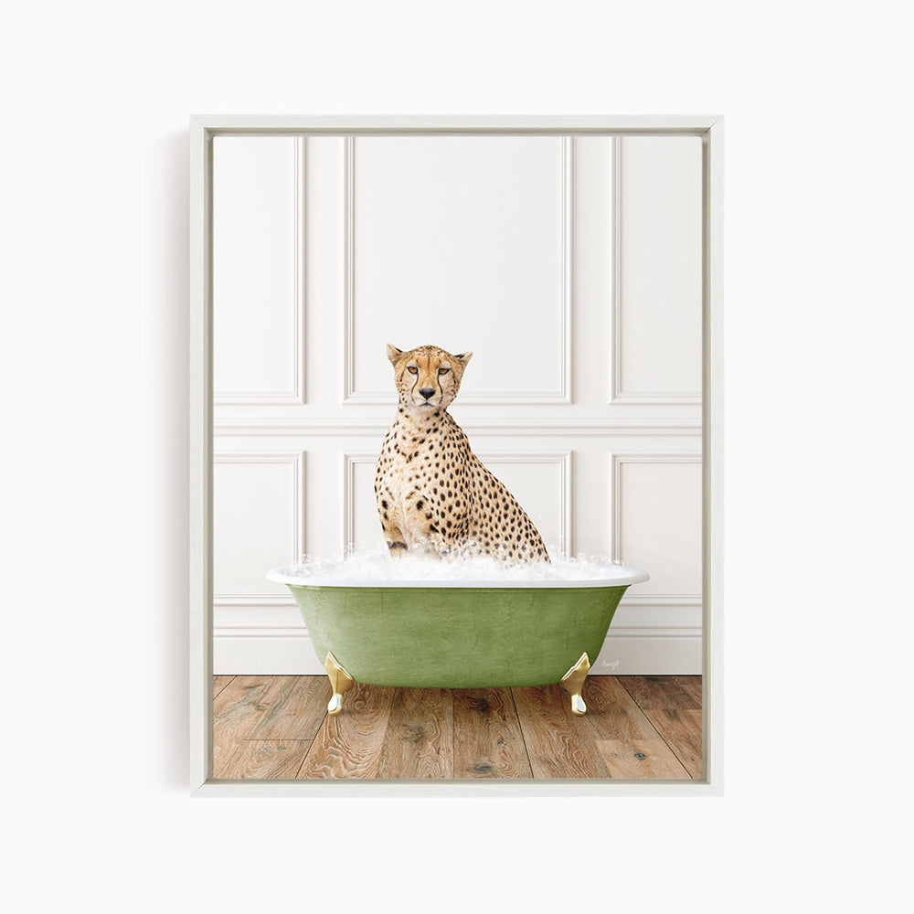 A cheetah sitting in a green bathtub filled with water, with a white wall and wooden floor in the background.