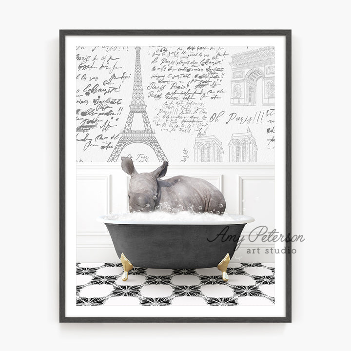 a rhino in a bathtub with the eiffel tower in the background